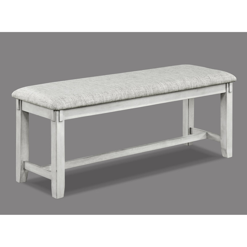 Banc contemporain en bois flotté avec assise rembourrée grise et pieds fuselés pour manger en bois massif dans l'espace