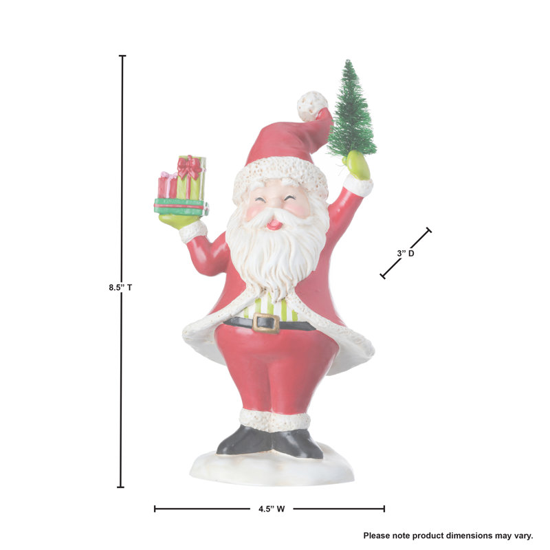 Père Noël tenant des paquets et un arbre