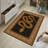 Golden Serpent Black Border Area Rug