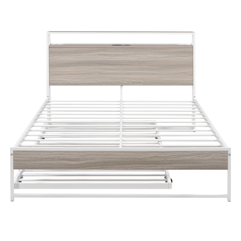 Structure de lit en métal blanc avec lit gigogne, ports et lattes. Stable et complet. Aucun sommier tapissier requis pour la taille de la chambre à coucher. Saillant.