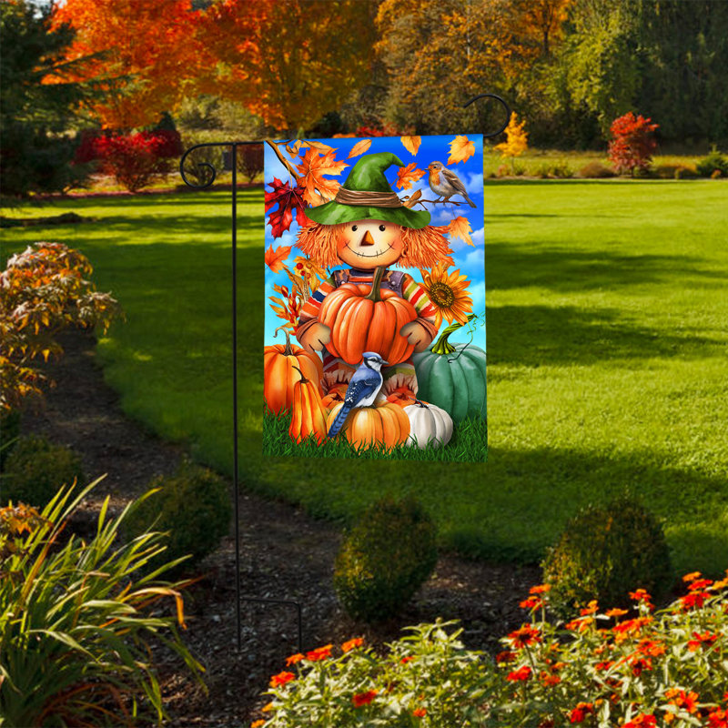 Drapeau souriant du jardin épouvantail