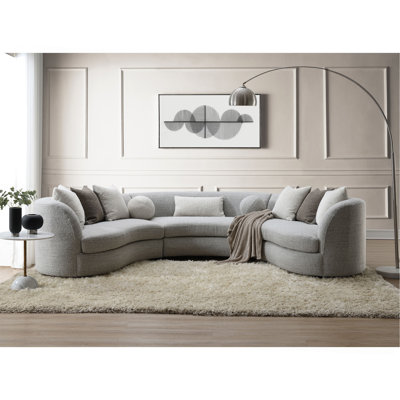 Canapé modulaire gris avec 9 coussins