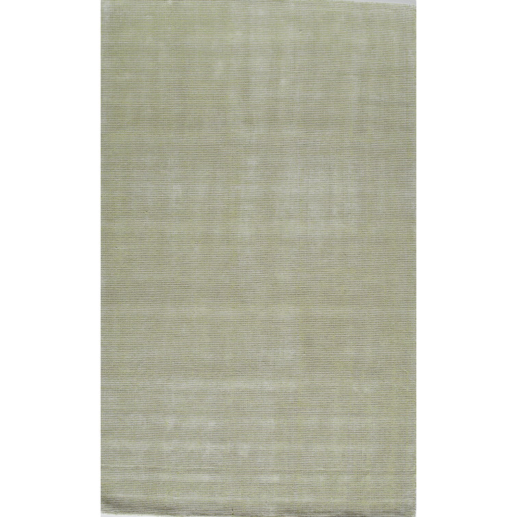 Tapis vert touffeté à la main
