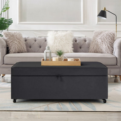 Grand canapé-lit moderne et confortable avec rangement et banc modulaire polyvalent avec roulettes et un rangement dissimulé pour l'organisation du salon