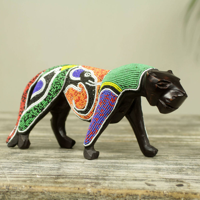 Figurine panthère avec éléphant et oiseau