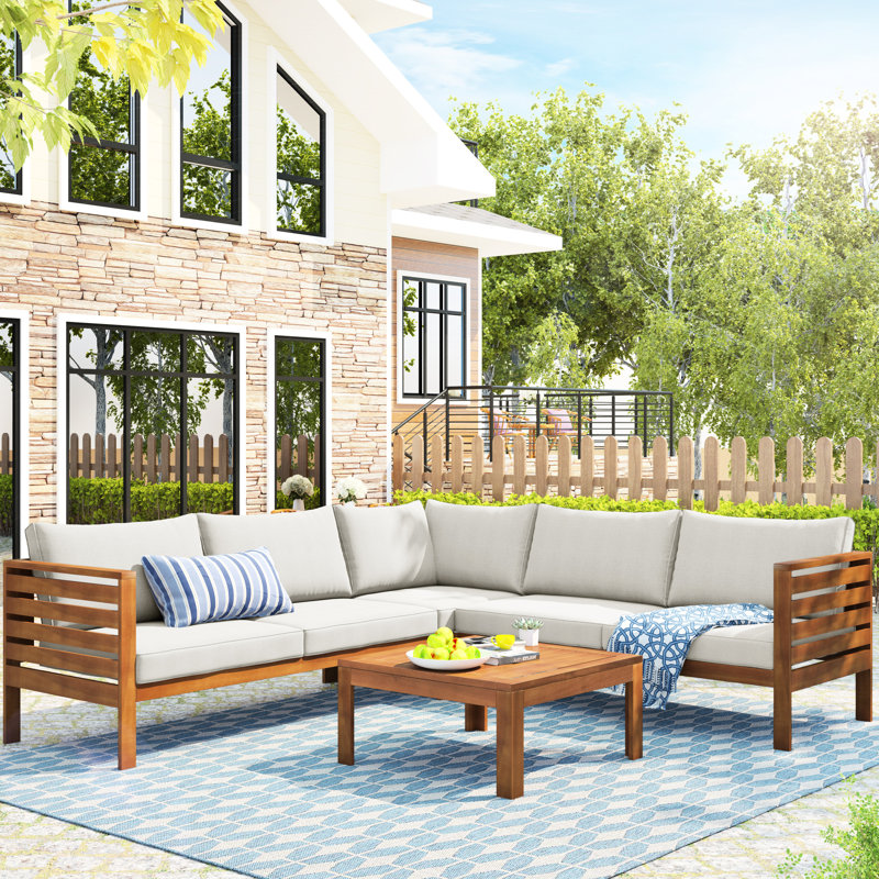 Gazebo de style japonais en bois, idéal pour se détendre, avec coussins gris et protection contre l'eau, parfait pour les garden-parties.