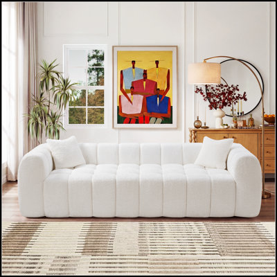 Canapé surdimensionné à motif de nuage guimauve avec siège profond et tissu bouclé doux pour le confort d'un salon moderne