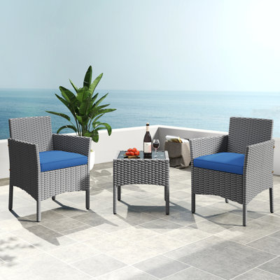  3-Piece Rattan Furniture Set with Tempered-glass Top Table and 2 Cushioned Chairs