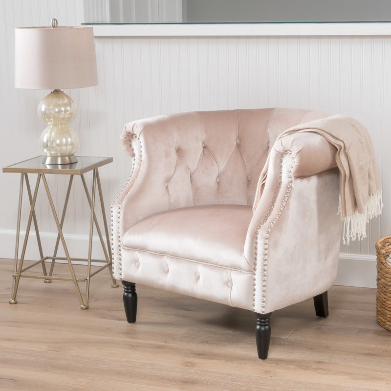 Fauteuil club en velours avec boutons