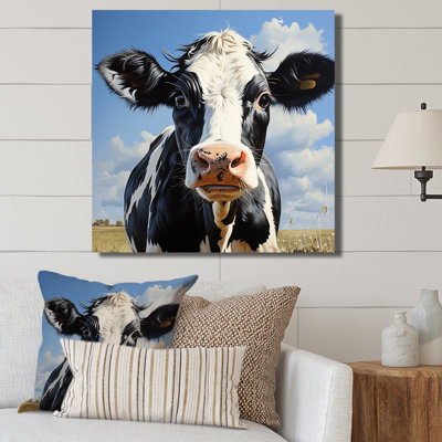 Vache noire et blanche broutant les prés II