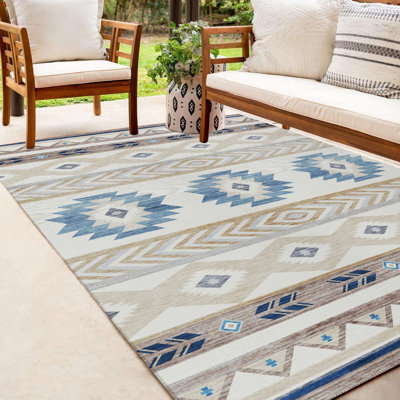Tapis ivoire / bleu en polyester tissé à la machine Mentzer Southwestern