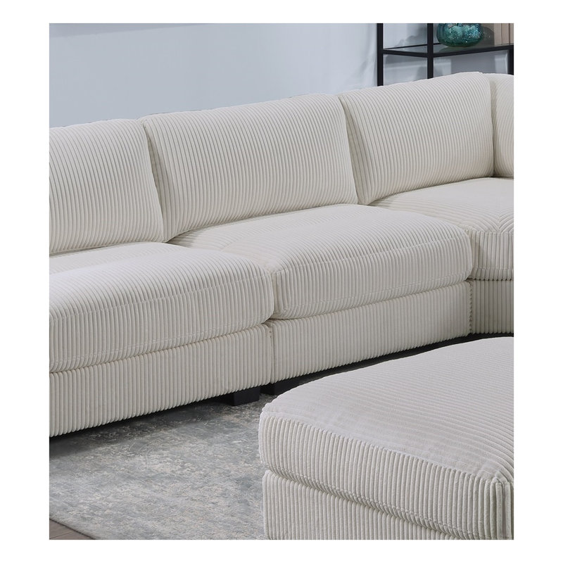 Fauteuil d'appoint en velours côtelé beige avec détails larges et pieds en bois
