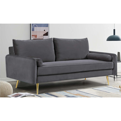 Canapé en velours de style Mid-Century avec revêtement clouté et pattes minces en métal, idéal pour les salons modernes et les petits espaces.