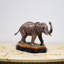 Porcelain Elephant Figurine With Bronze Tusks and Tail Accents On Wood Base
