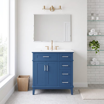 Meuble-lavabo standard autoportant de 76 cm (30 po) en bois massif et MDF, bleu, avec lavabo en céramique, portes à fermeture amortie et tiroir profond. Robinetterie non incluse.