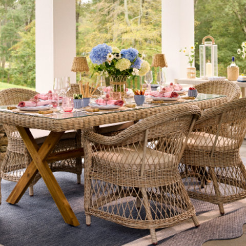 Outdoor dining table and chairs on a patio.