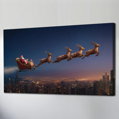Grand traîneau du Père Noël au-dessus de la ville Abhinaya - Fête d'hiver du père Noël renne, impressions sur toile, photos d'art mural des Fêtes, décorations de Noël prêtes à être accrochées, 20 po x 40 po