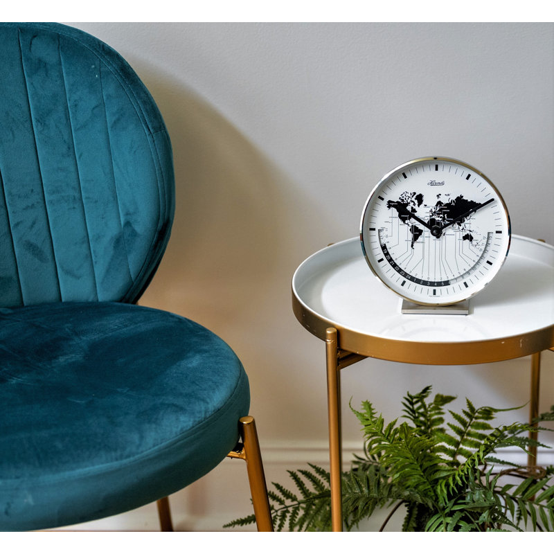 Nickel Plated Table Clock with a Quartz Time Only Movement   Dial features a world map and different time zones.
