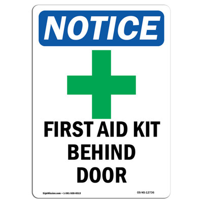 First Aid Kit Behind Sign