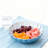 Blue petal-shaped fruit bowl with stand
