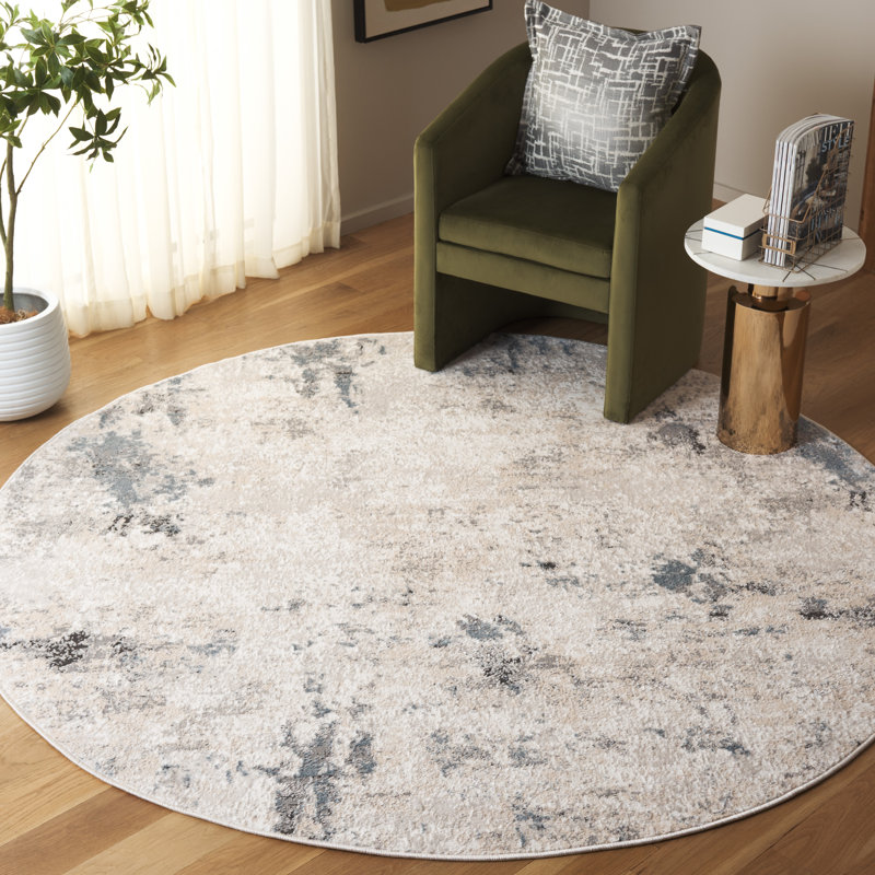 Ivory and Beige Abstract Synthetic 8' x 10' Rug