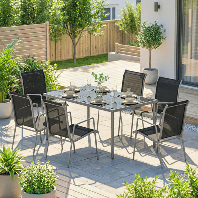 Ensemble de salle à manger de jardin 7 pièces avec 6 chaises empilables, noir