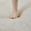 Repose-pieds en velours beige