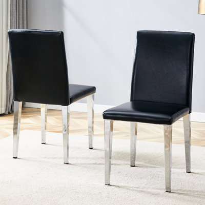 Deux chaises de salle à manger en polyuréthane noir avec des pieds en métal argenté, un look simple et tendance, un corps confortable - taille convenable, assemblage facile de 2 designs exquis, élasticité du coussin souple, corrosion