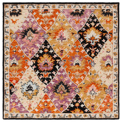 Fredick Tufted Wool/Cotton Southwestern Rug in Yellow/Black/Pink