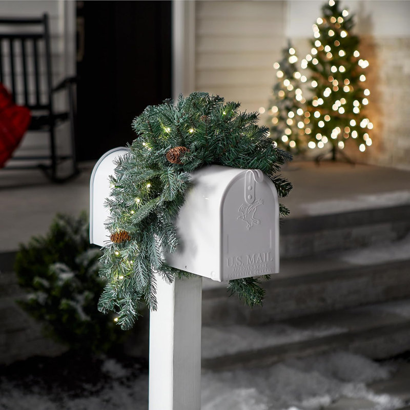 The Holiday Aisle® 36 in. Frosted Arctic Spruce Mailbox Swag with LED Lights