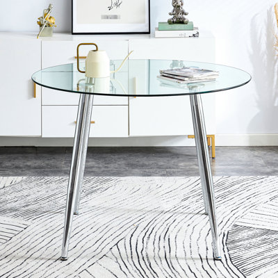 Un plateau de table en verre d'un diamètre de 38,6 pouces et une table de salle à manger circulaire minimaliste moderne avec des pieds en métal. Convient pour les salons et les salles de conférence.