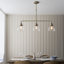 Anais 3-Light Linear Chandelier finished in Ant. Brass