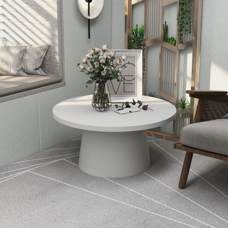 Table basse ronde en fibre de pierre avec piédestal Ladislava, Blanc