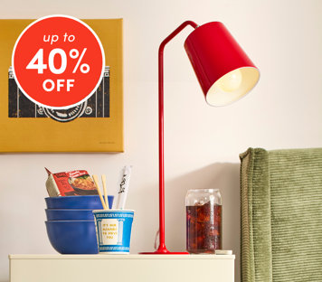 Lamps up to 40% off featuring red modern desk lamp on side table with bowls and decor