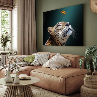 Leopard Looking at Butterfly Canvas Print
