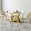 Table de salle à manger de luxe 68,9 po avec plateau en verre transparent et base courbée moderne dorée