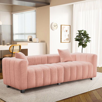 Canapé 3 places en velours, 212 cm de long, pour salon ou chambre. Modulaire, confortable et élégant, il s'intègre à tous les intérieurs. Siège rose, style moderne et modulaire, structure en bois, coussins et dossiers confortables.