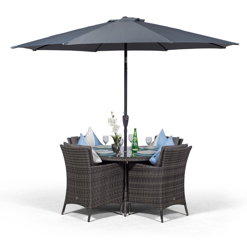 Karcher 4 - Person Wicker Patio Dining Set with Round Table , Cushions Included
