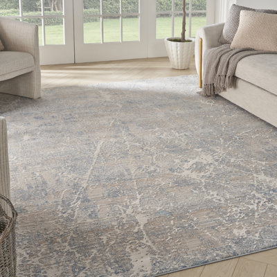 Tapis bleu / beige en polyester / polypropylène tissé à la machine à motif abstrait Zennie