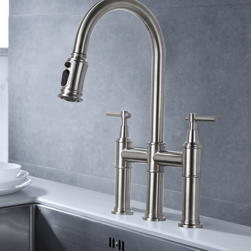 Robinet de cuisine en nickel brossé avec fonction rétractable. Double poignée pour un contrôle précis du débit et de la température. Espace pour évier élargi à 360 ° avec une grande buse rotative. Robinet en laiton. Silencieux éclaboussures d'eau