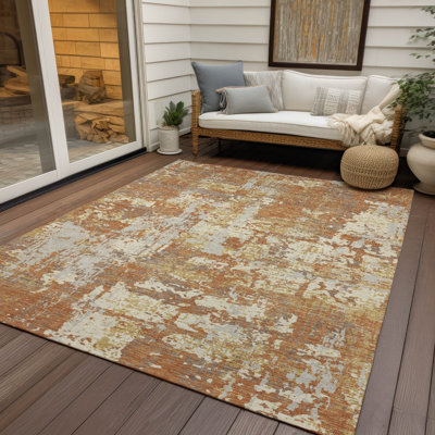 Tapis intérieur / extérieur orange Caelan 