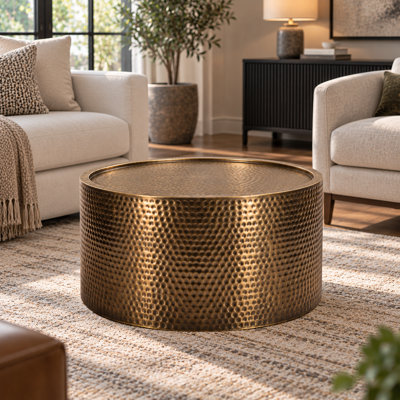 Round Coffee Table with Antique Brass Finish and Hammered Iron Design