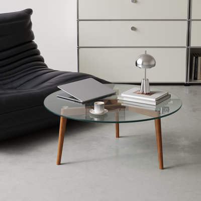 Table basse avec plateau en verre et structure en bois massif