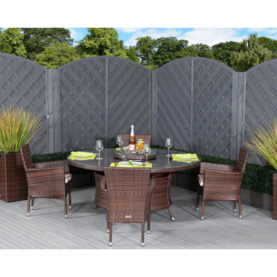 Escobar 4 - Person Patio Dining Set with Round Table , Cushions Included