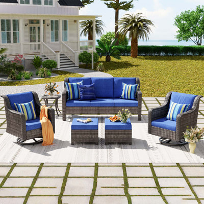 Canapé 3 places + 2 chaises pivotantes + 2 repose-pieds + 1 table d'appoint