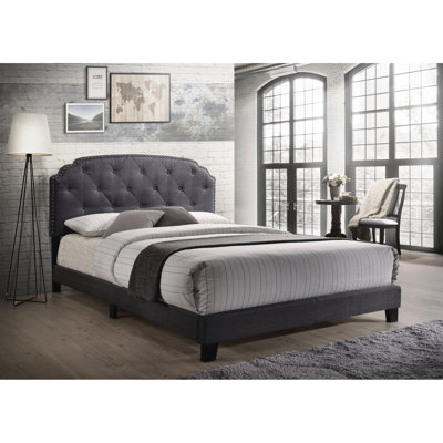 Grand lit en tissu gris avec rembourrage concave et structure en arche de soutien