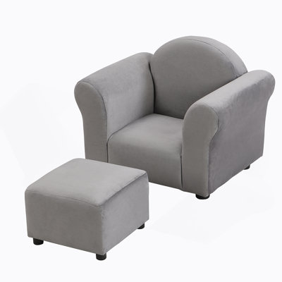 Canapé rembourré pour enfants avec repose-pieds, une option de siège confortable et durable pour que les petits puissent se détendre et jouer.