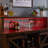 Gruber Farmhouse 55"W Wine Coffee Bar Cabinet With LED Lights, Sliding Barn Door, Wine & Glass Rack-911850307