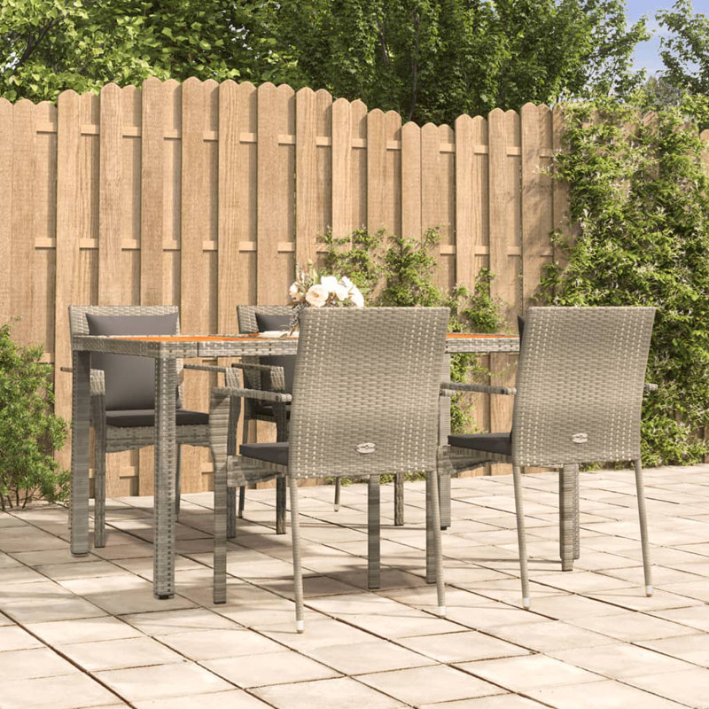 Dasmon 4 - Person Wicker Patio Dining Set with Rectangular Table , Cushions Included, Gray, Gray
