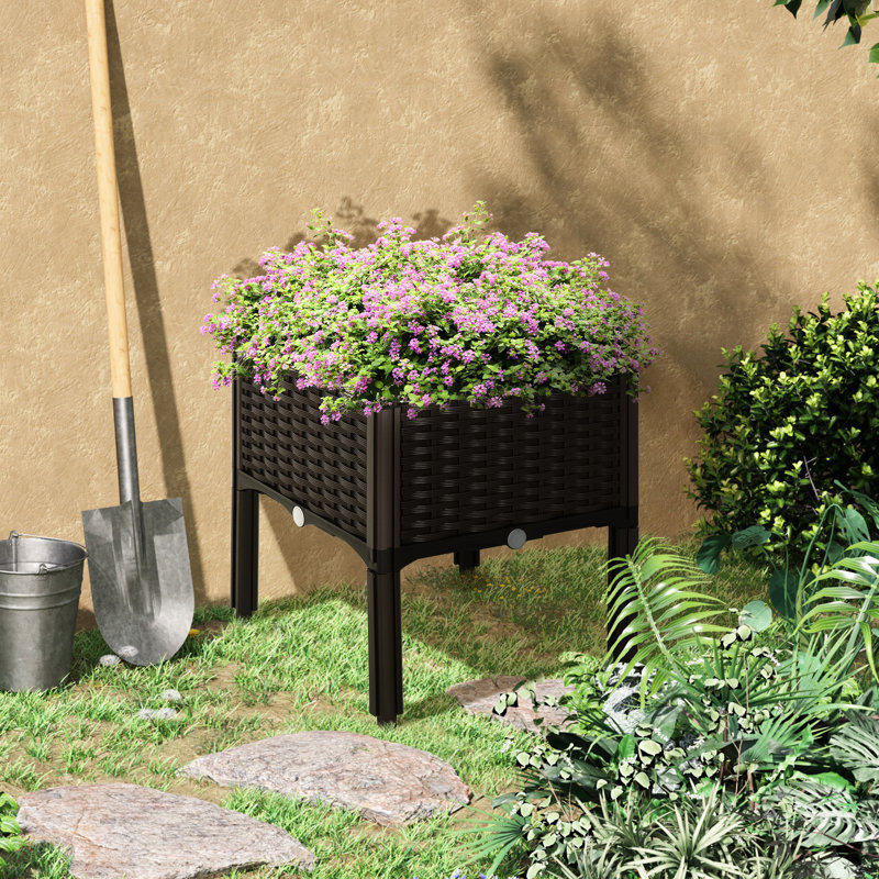 Boîte à fleurs brune surélevée pour jardin